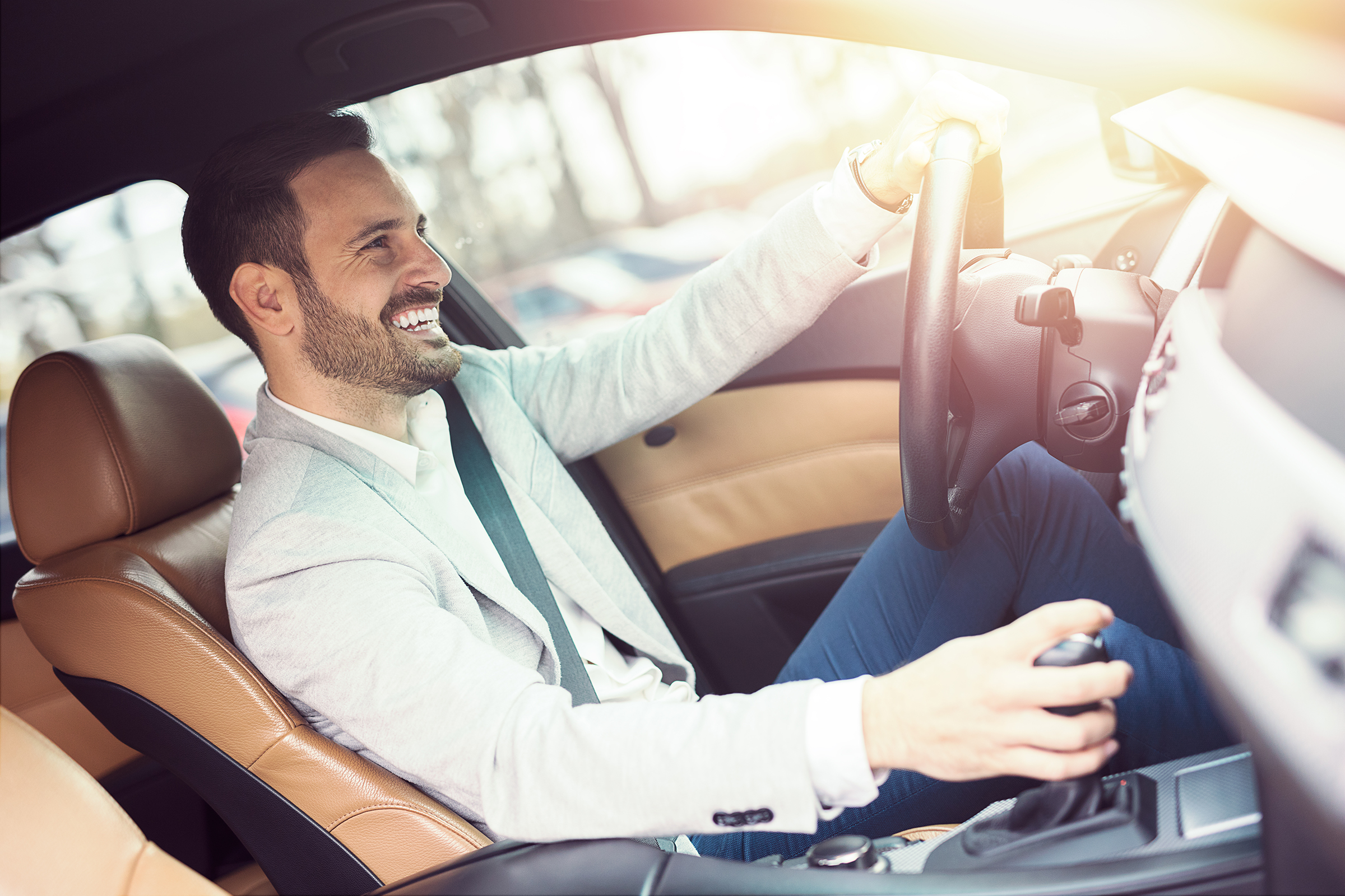 Businessman,Driving,A,Car. Businessman driving a car, Insurance Arlington, Massachusetts
